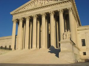 US Supreme Court building, front elevation, steps and porticoby Duncan Lock, used under CCA-SA